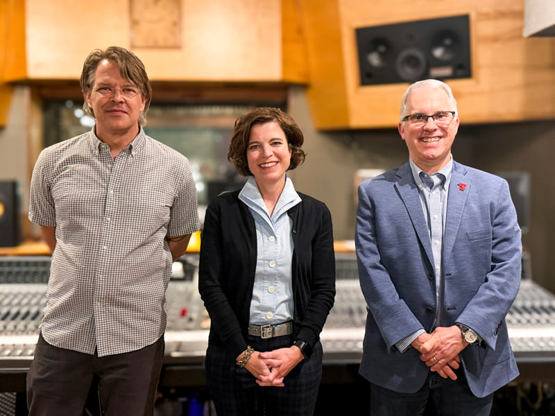 The Electrical Audio Foundation's board of directors, left to right: Tim Midyett, Amy Roy and Andrew Hibel, standing in front of the mixing console at Electrical Audio.